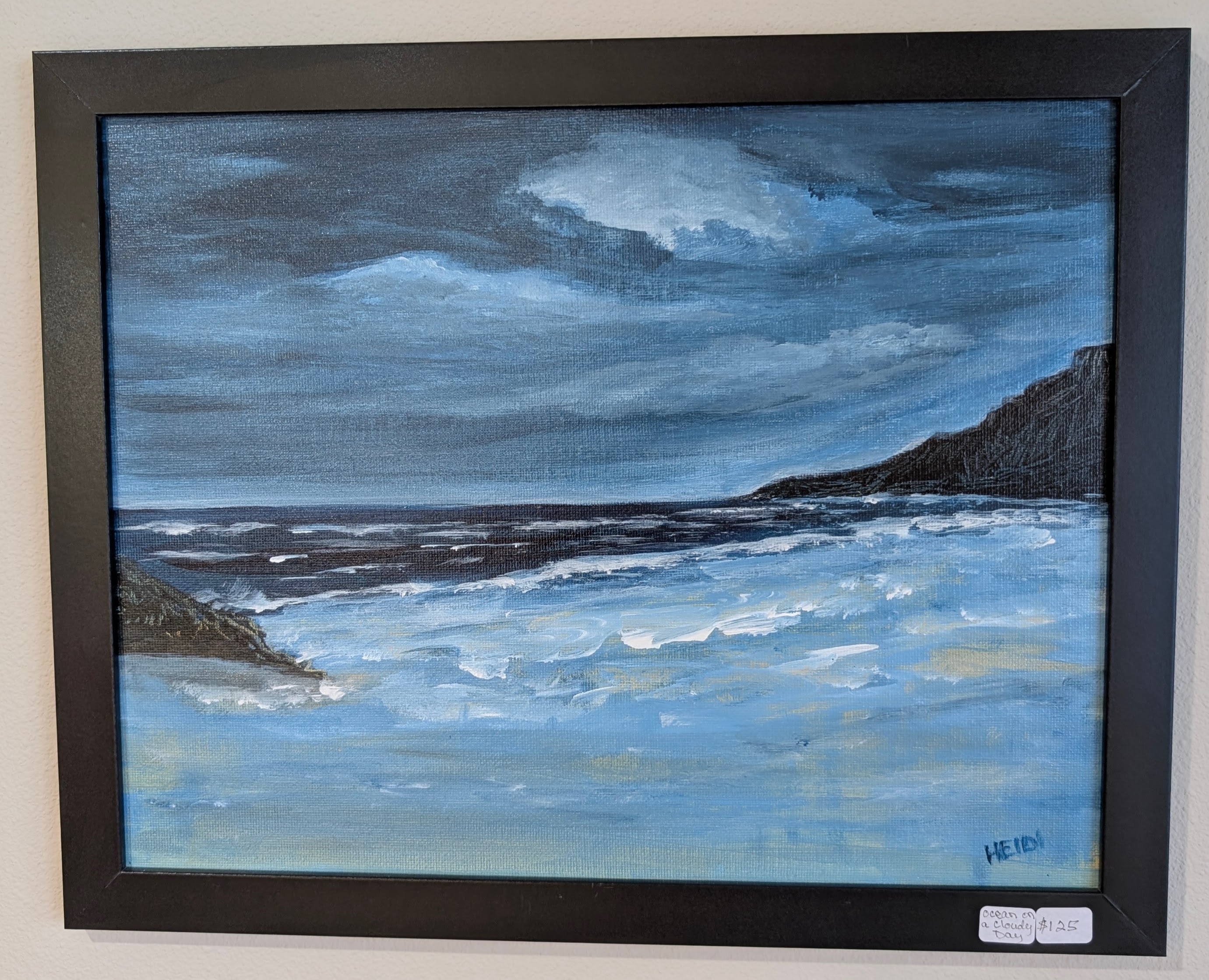Acrylic seascape with waves meeting a rocky shoreline under a brooding sky