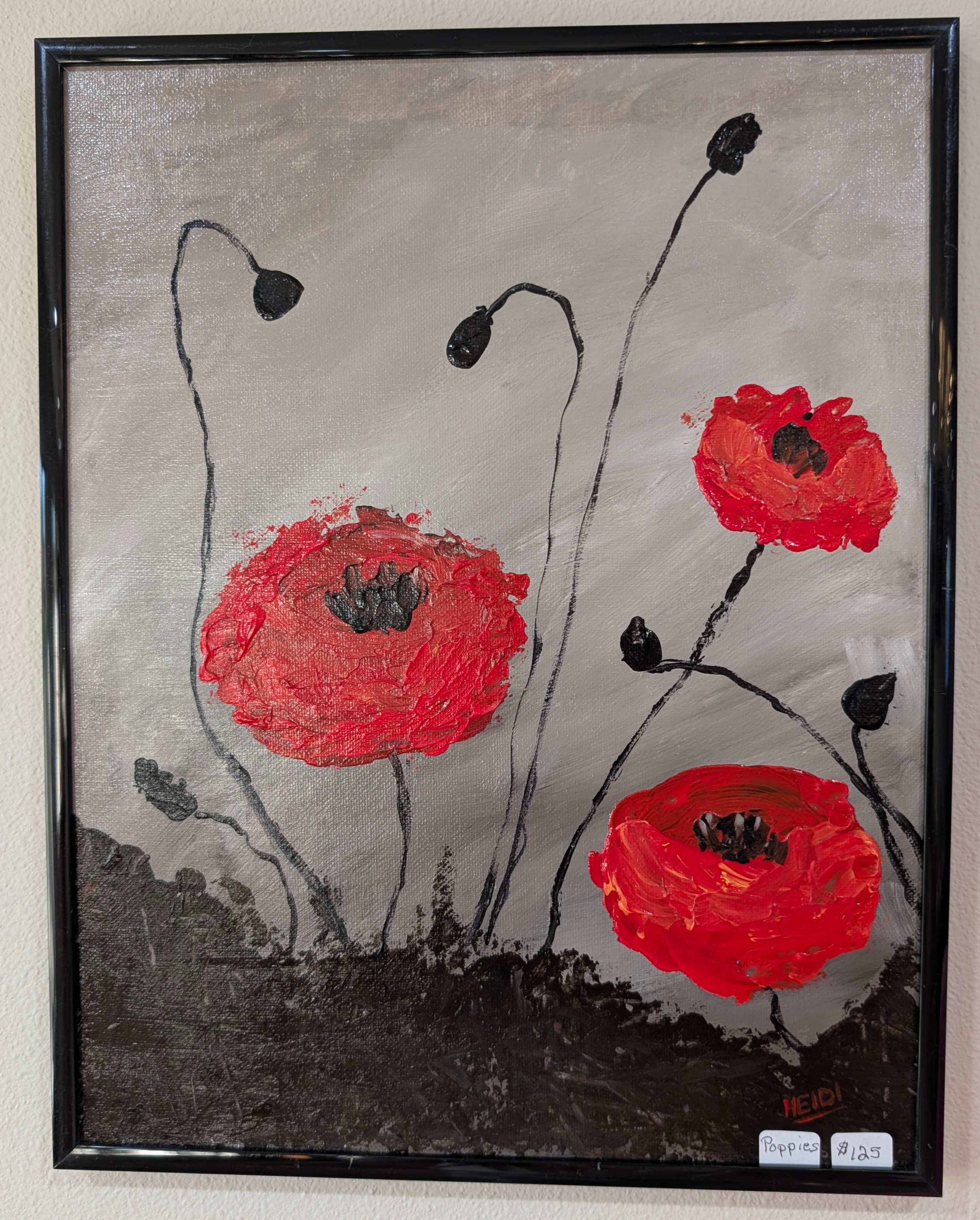Acrylic poppy flowers with textured red petals on a neutral background